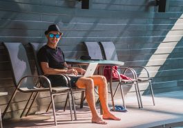 Man, laptop, work — Building Credit in Canada: A Comprehensive Guide to Credit Builder Loans