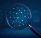 A magnifying glass focusing on a network of interconnected nodes against a dark tech background.